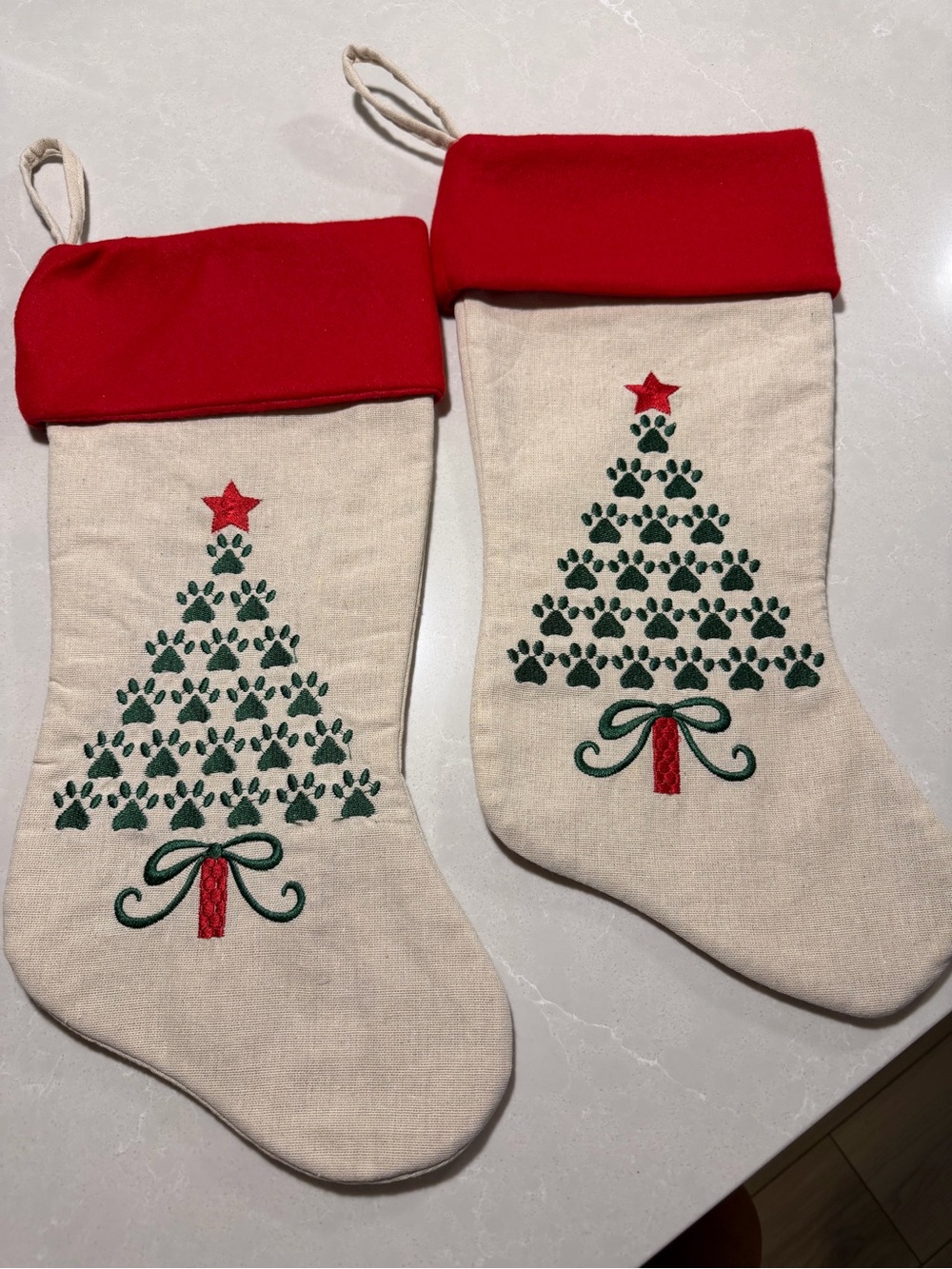 Dog Christmas stockings- green paw prints. Red felt top -